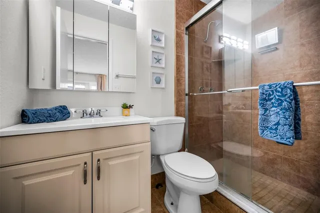 a bedroom with two beds and a large window