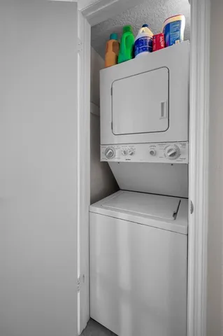 a kitchen with stainless steel appliances granite countertop a stove and a microwave