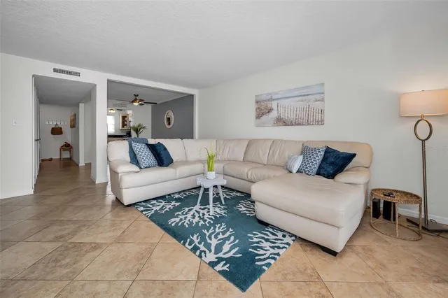 a room with a table chairs and a flat screen tv