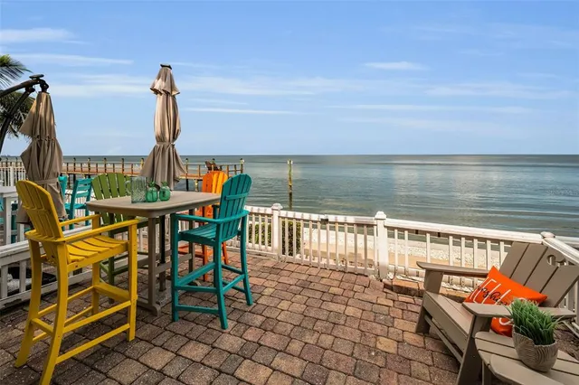 a balcony with an outdoor seating