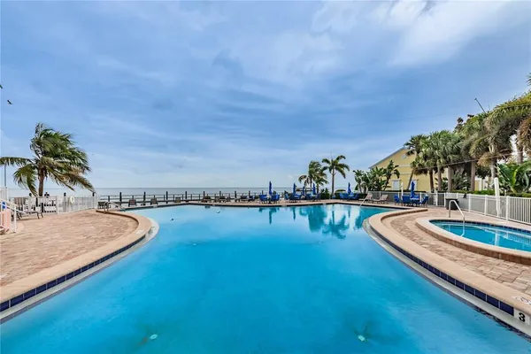 a view of swimming pool with seating space