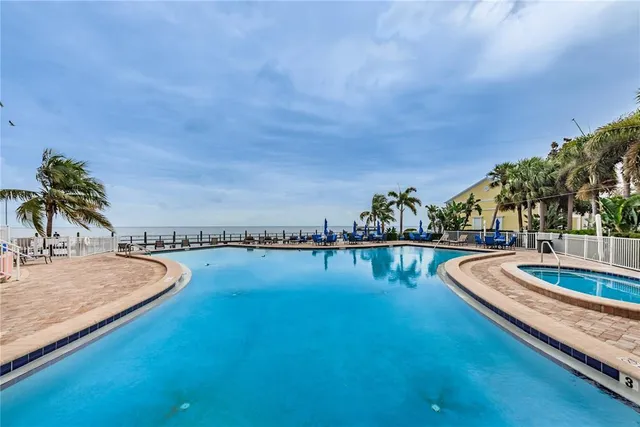 a view of swimming pool with seating space