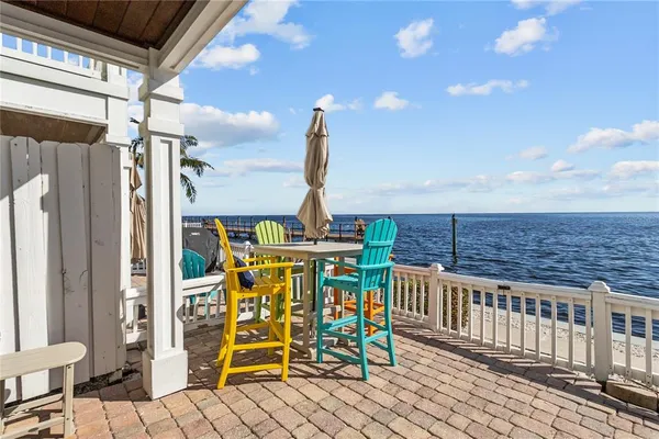 a view of a balcony with chairs