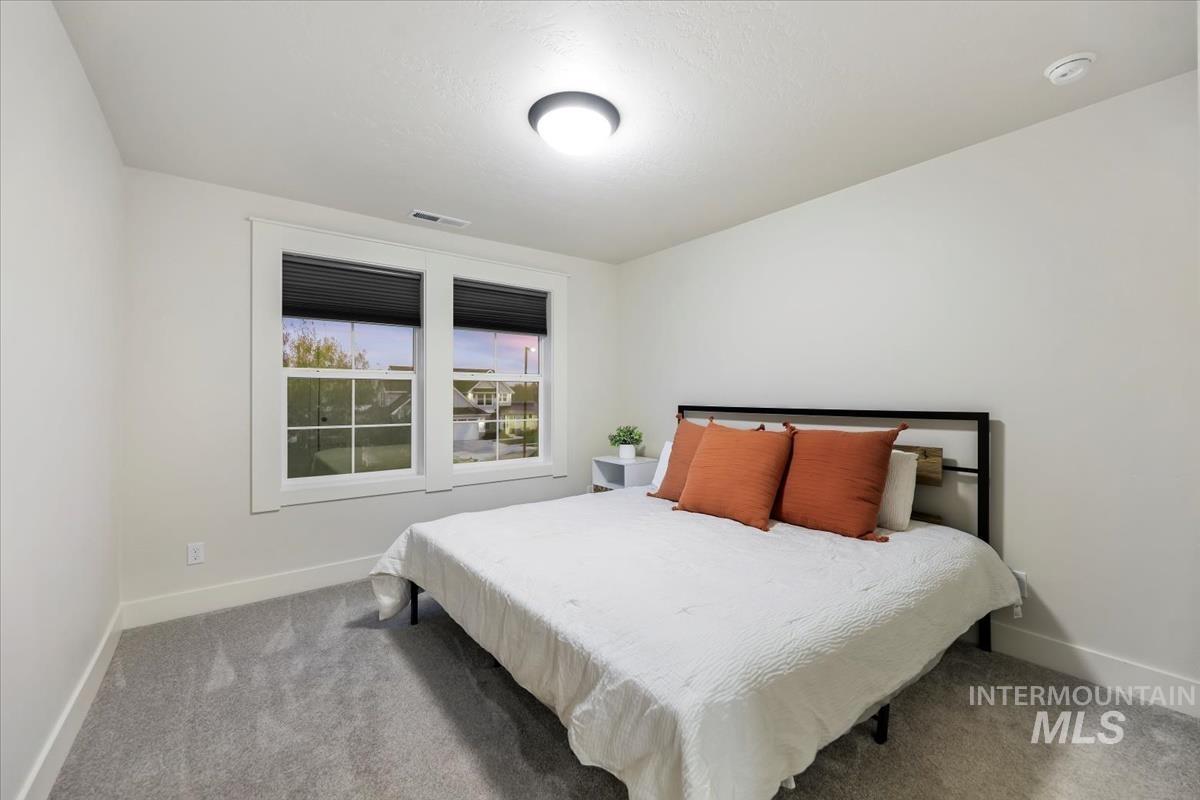 4705 North Morpheus Place Meridian, ID 83646 - Photo 33 of 45 Carpeted bedroom with baseboards
