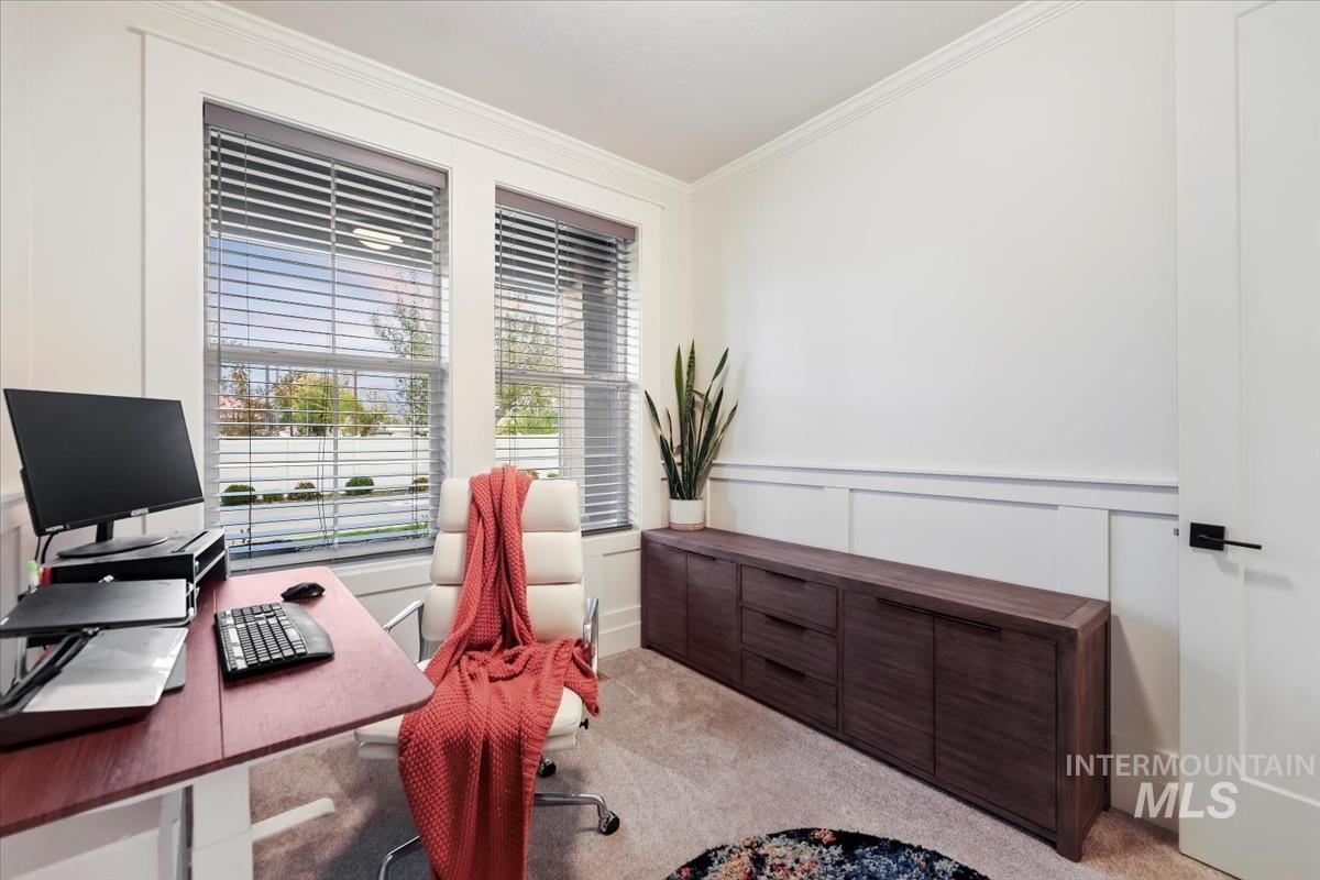 4705 North Morpheus Place Meridian, ID 83646 - Photo 40 of 45 Carpeted home office with crown molding and a decorative wall
