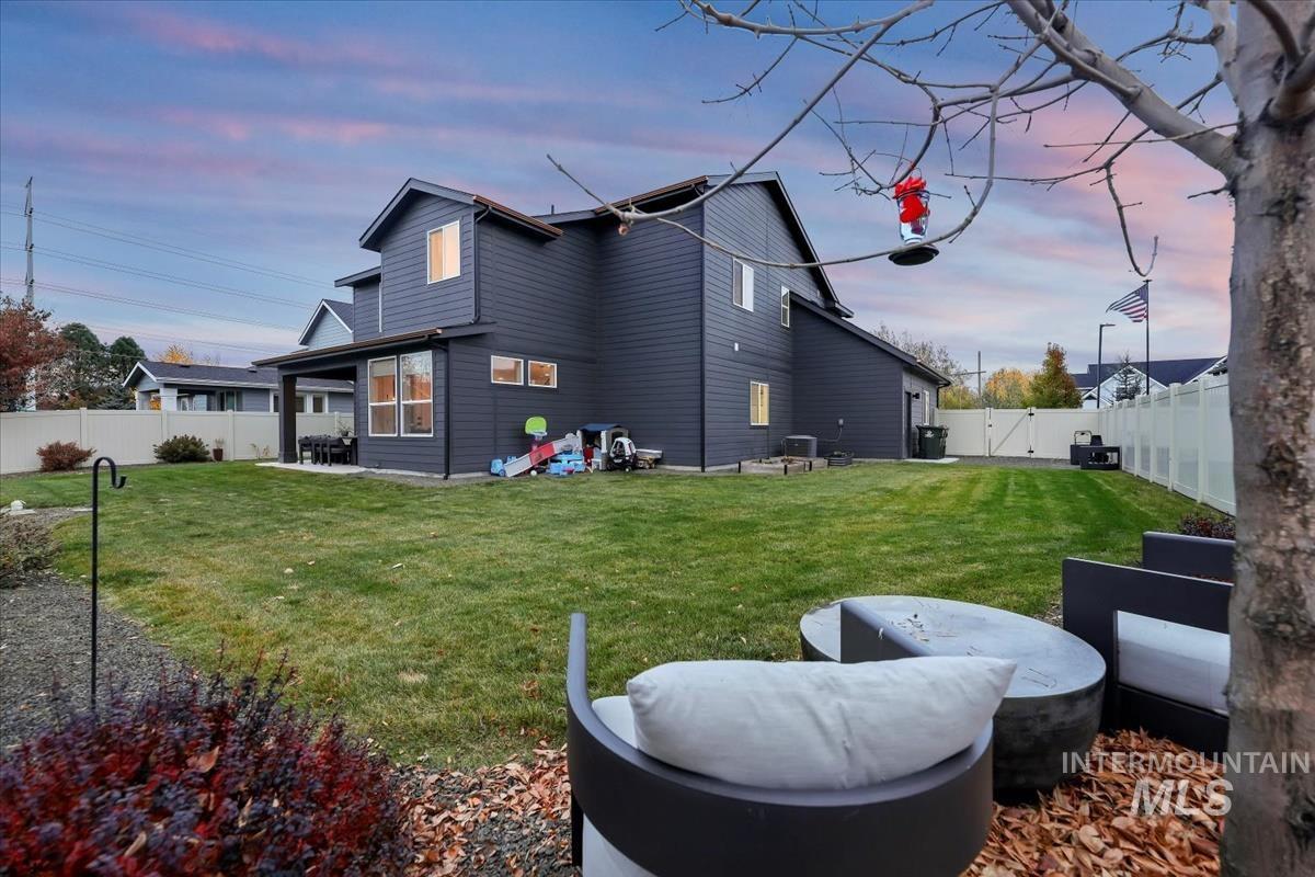 4705 North Morpheus Place Meridian, ID 83646 - Photo 44 of 45 Rear view of property with a patio area and a fenced backyard