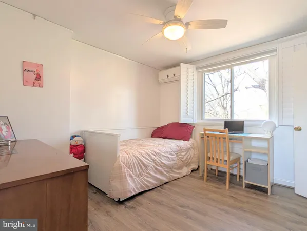 a bedroom with a bed and a table in it