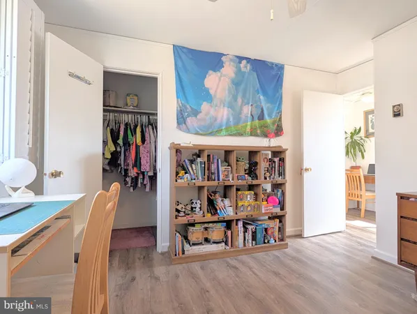 a living room with lots of furniture and a book shelf