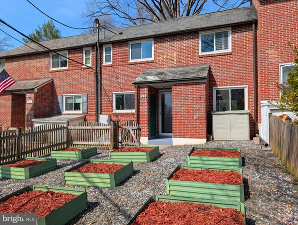 a front view of house and yard with seating space
