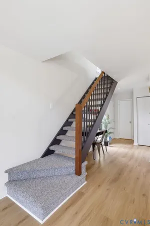 a bedroom with a bed and lamp