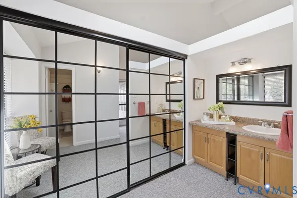 a bathroom with a toilet and a shower curtain