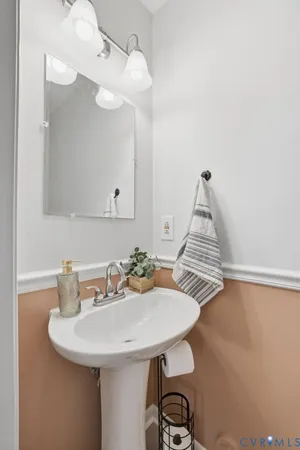 a kitchen with a refrigerator stove and white cabinets