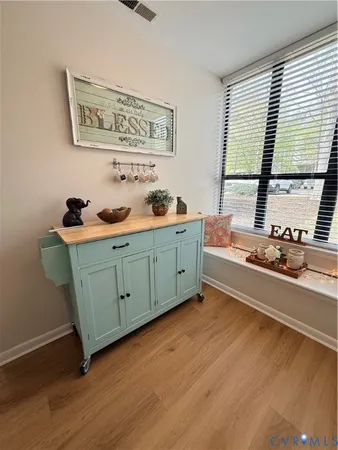 a front view of a house with sitting area