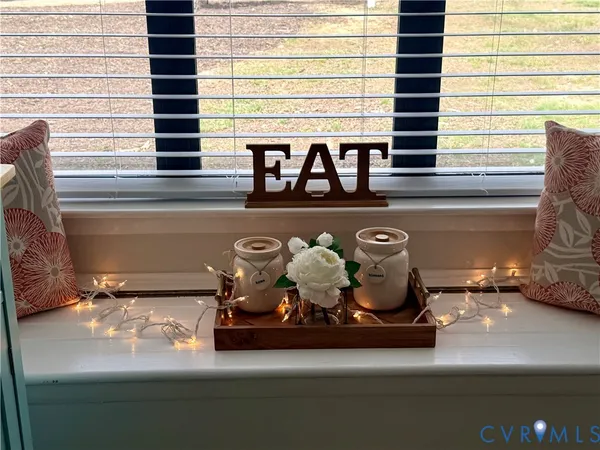 a view of living room with furniture and window