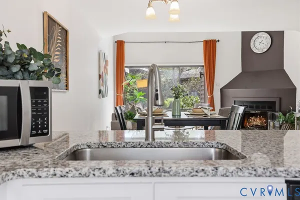 a workspace with wooden floor and furniture