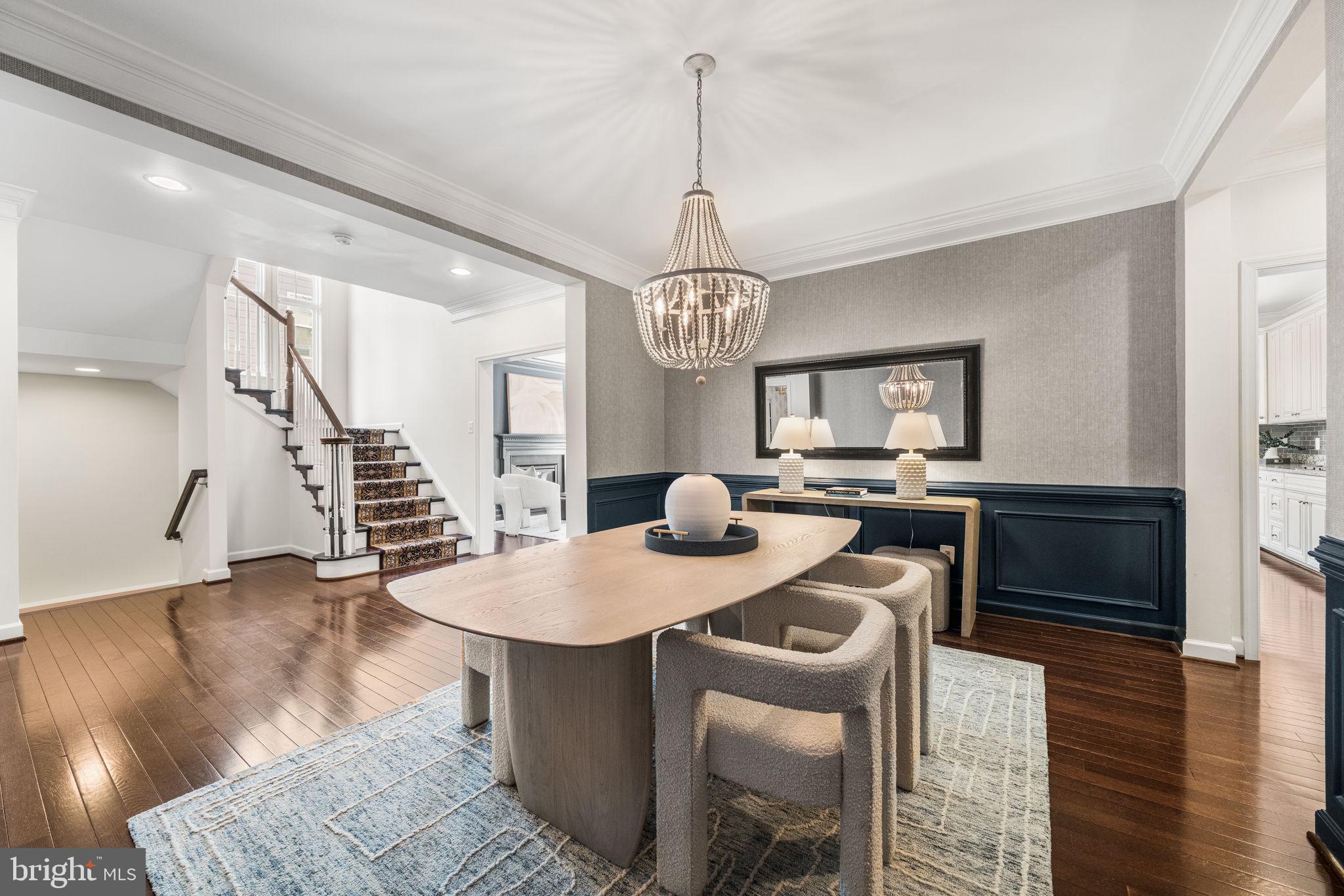 8032 Washington Road Alexandria, VA 22308 - Photo 14 of 50 a dining room with furniture a chandelier and wooden floor