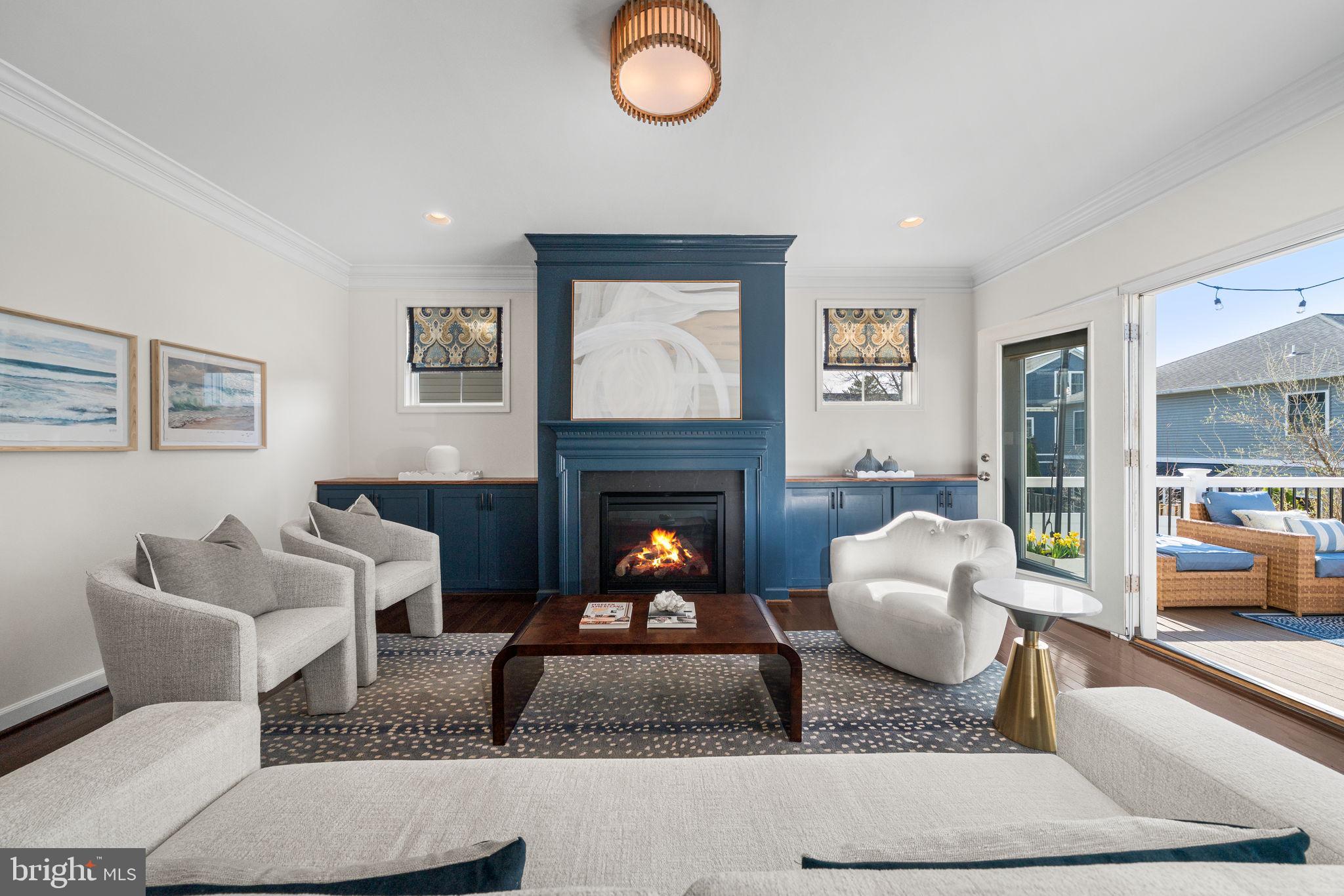8032 Washington Road Alexandria, VA 22308 - Photo 16 of 50 a living room with furniture and a fireplace