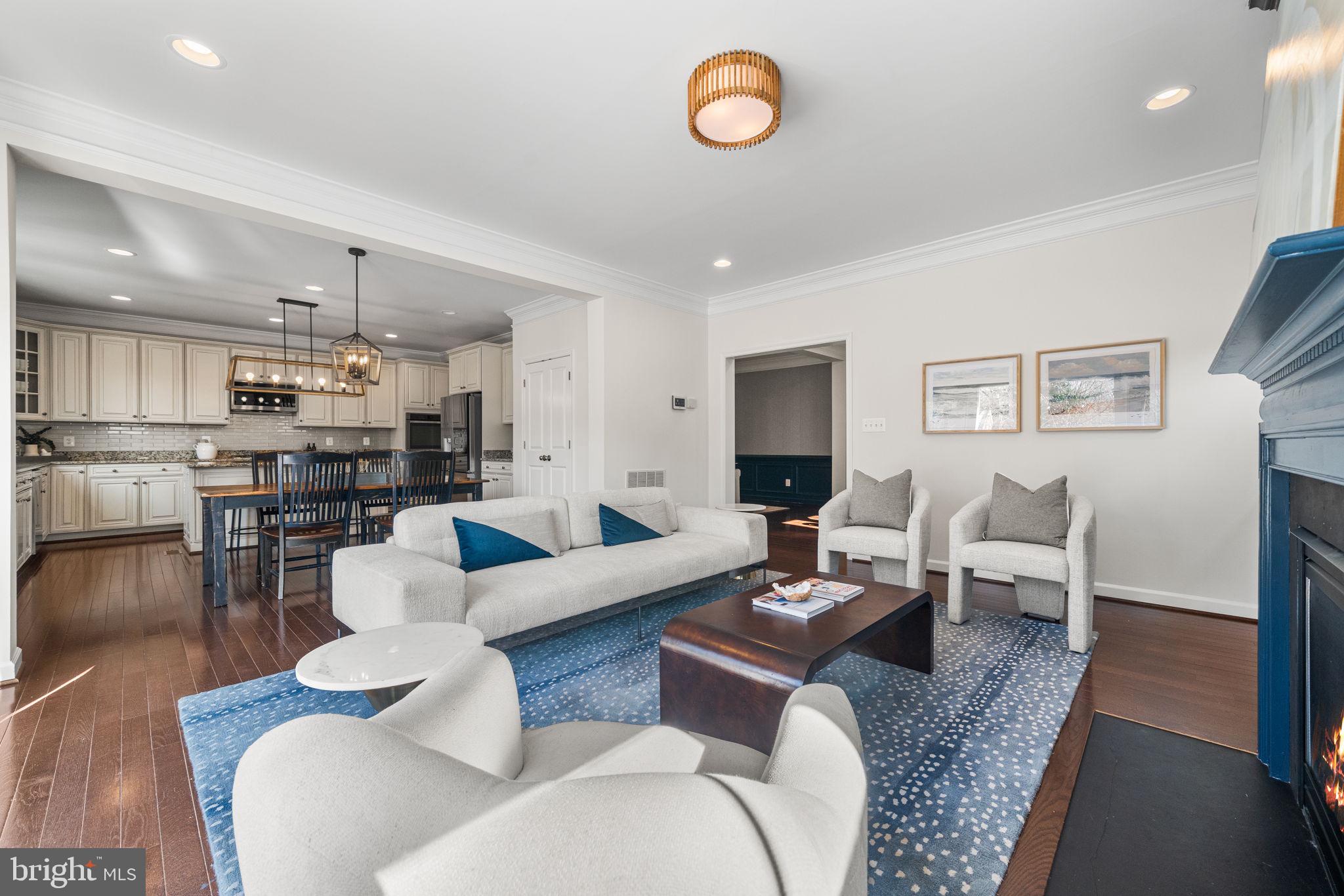 8032 Washington Road Alexandria, VA 22308 - Photo 18 of 50 a living room with furniture kitchen view and a table