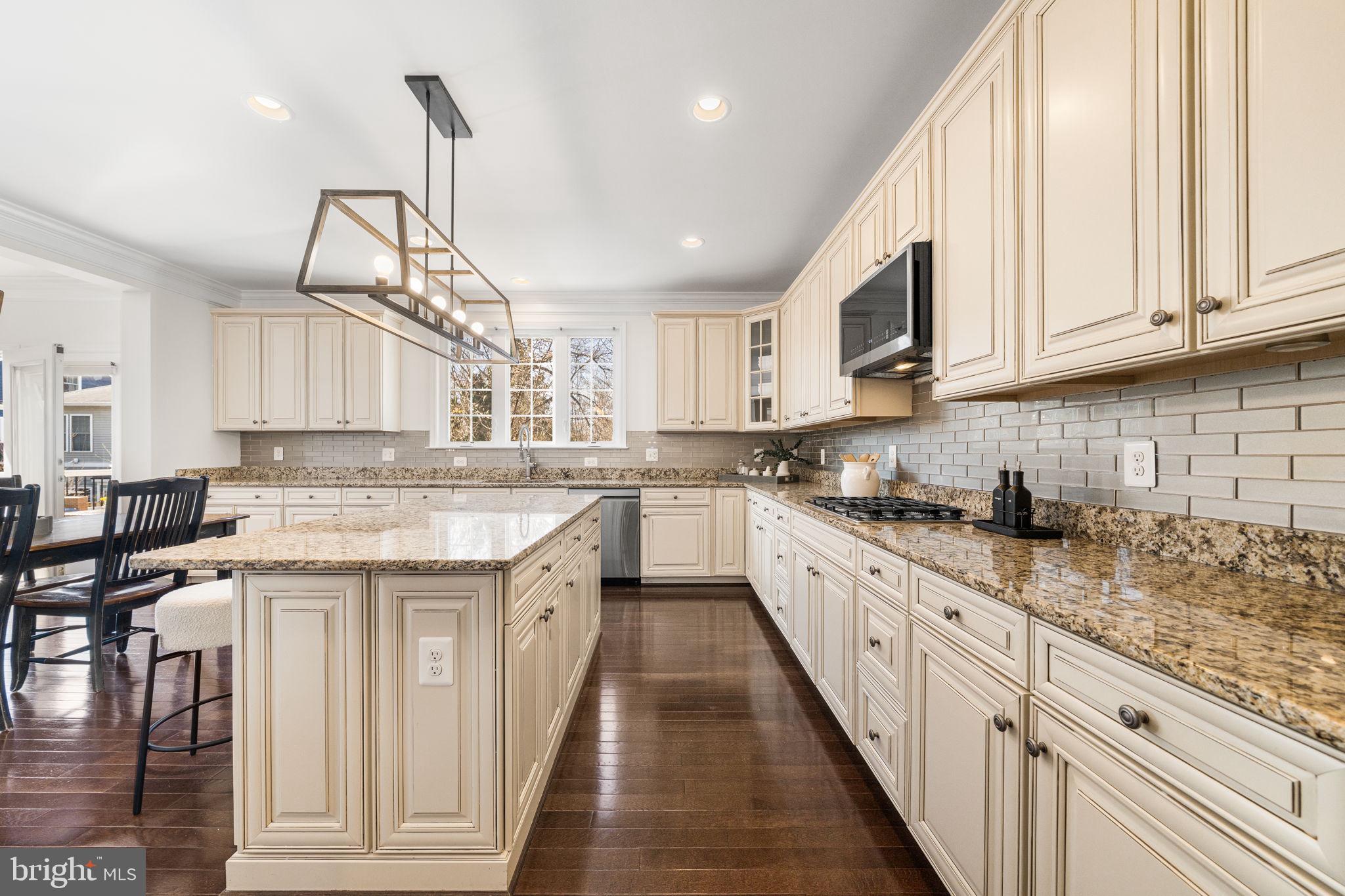 8032 Washington Road Alexandria, VA 22308 - Photo 21 of 50 a kitchen with granite countertop a sink a counter space appliances and cabinets