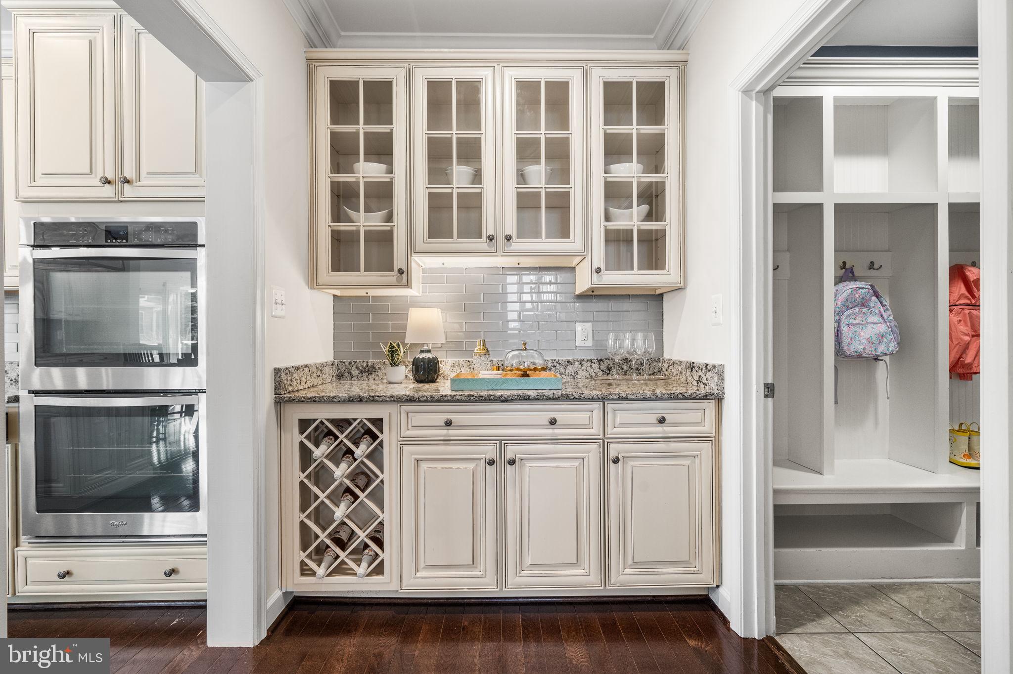 8032 Washington Road Alexandria, VA 22308 - Photo 24 of 50 a kitchen with stainless steel appliances granite countertop a stove and a microwave