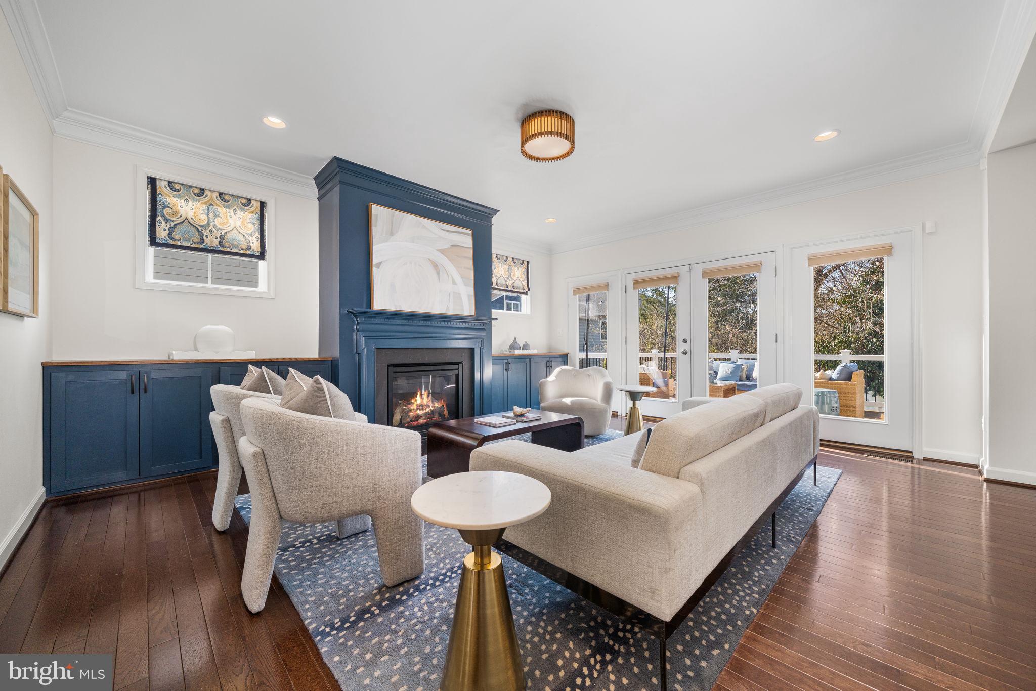 8032 Washington Road Alexandria, VA 22308 - Photo 3 of 50 a living room with fireplace furniture and a wooden floor