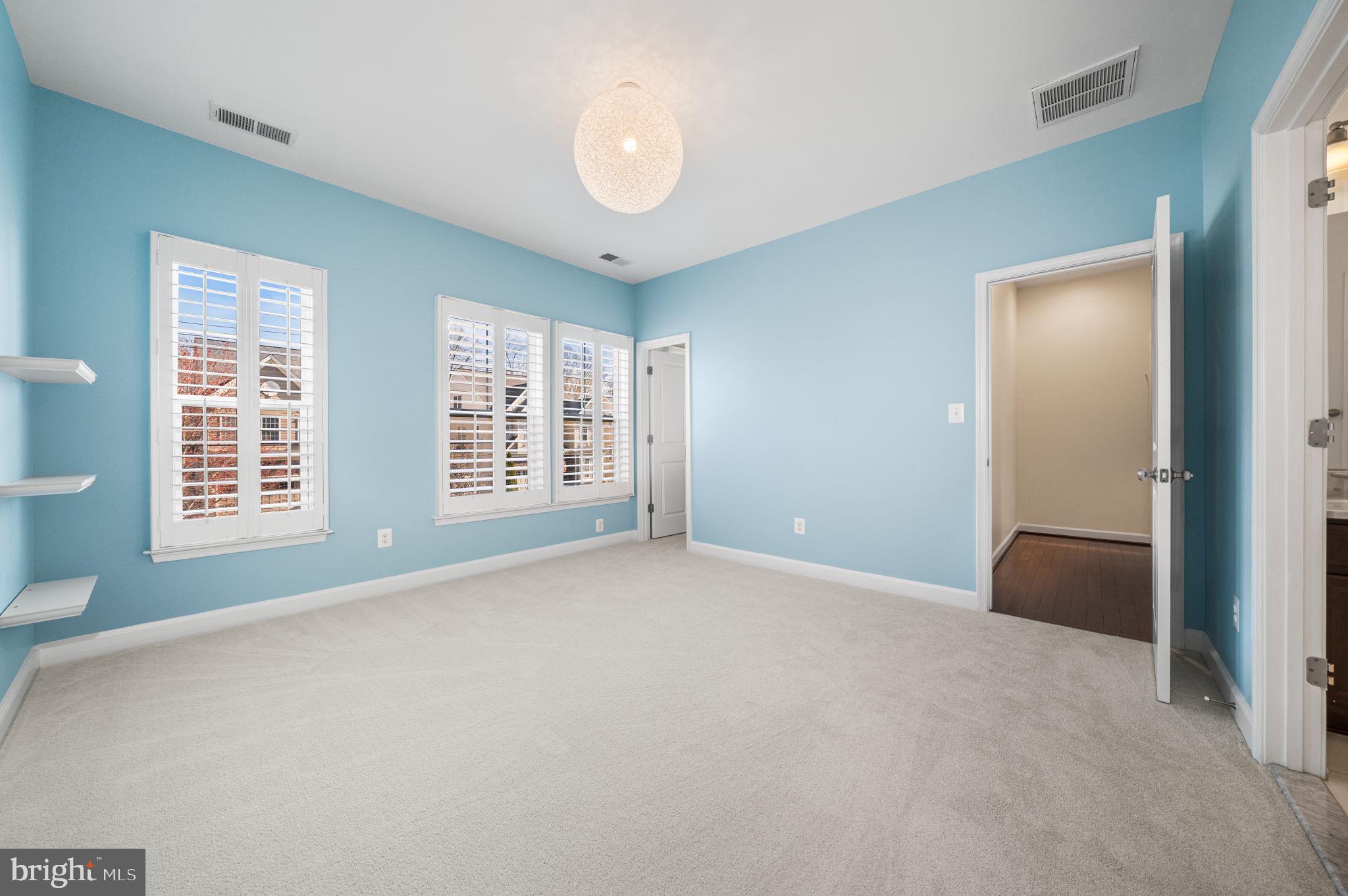 8032 Washington Road Alexandria, VA 22308 - Photo 36 of 50 an empty room with windows and closet