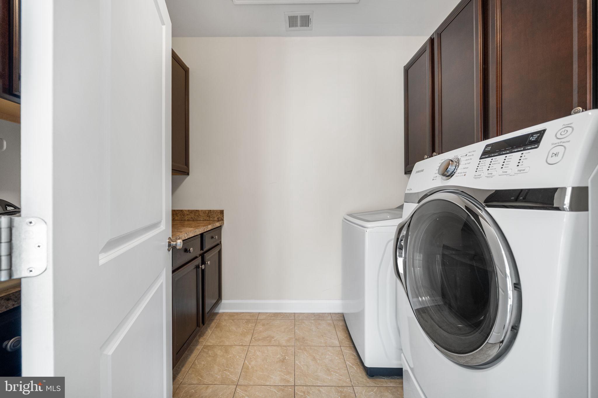 8032 Washington Road Alexandria, VA 22308 - Photo 39 of 50 a utility room with dryer and washer