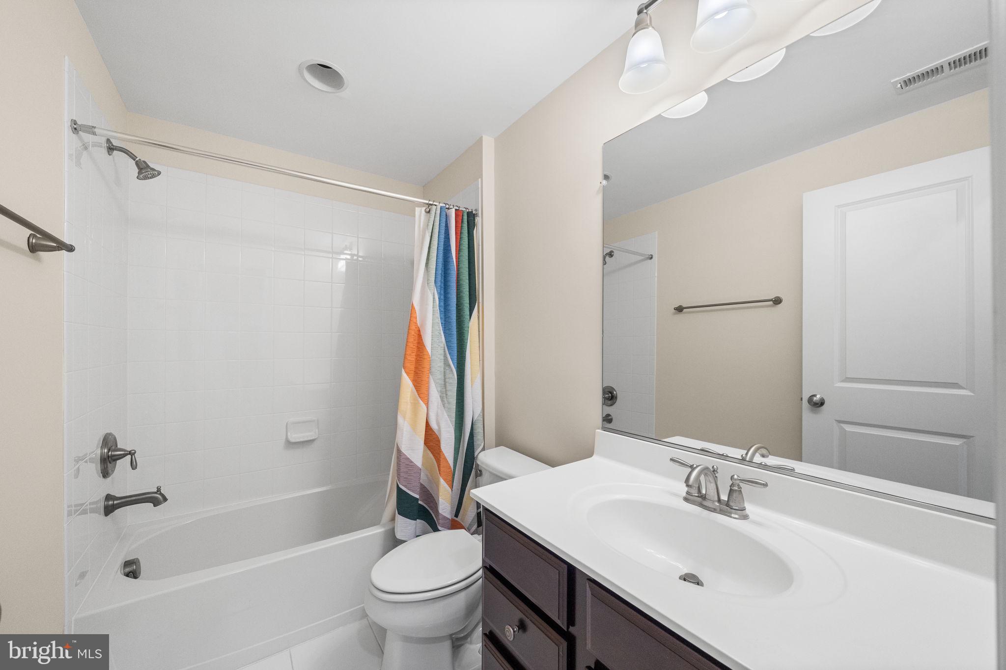 8032 Washington Road Alexandria, VA 22308 - Photo 43 of 50 a bathroom with a sink toilet and shower