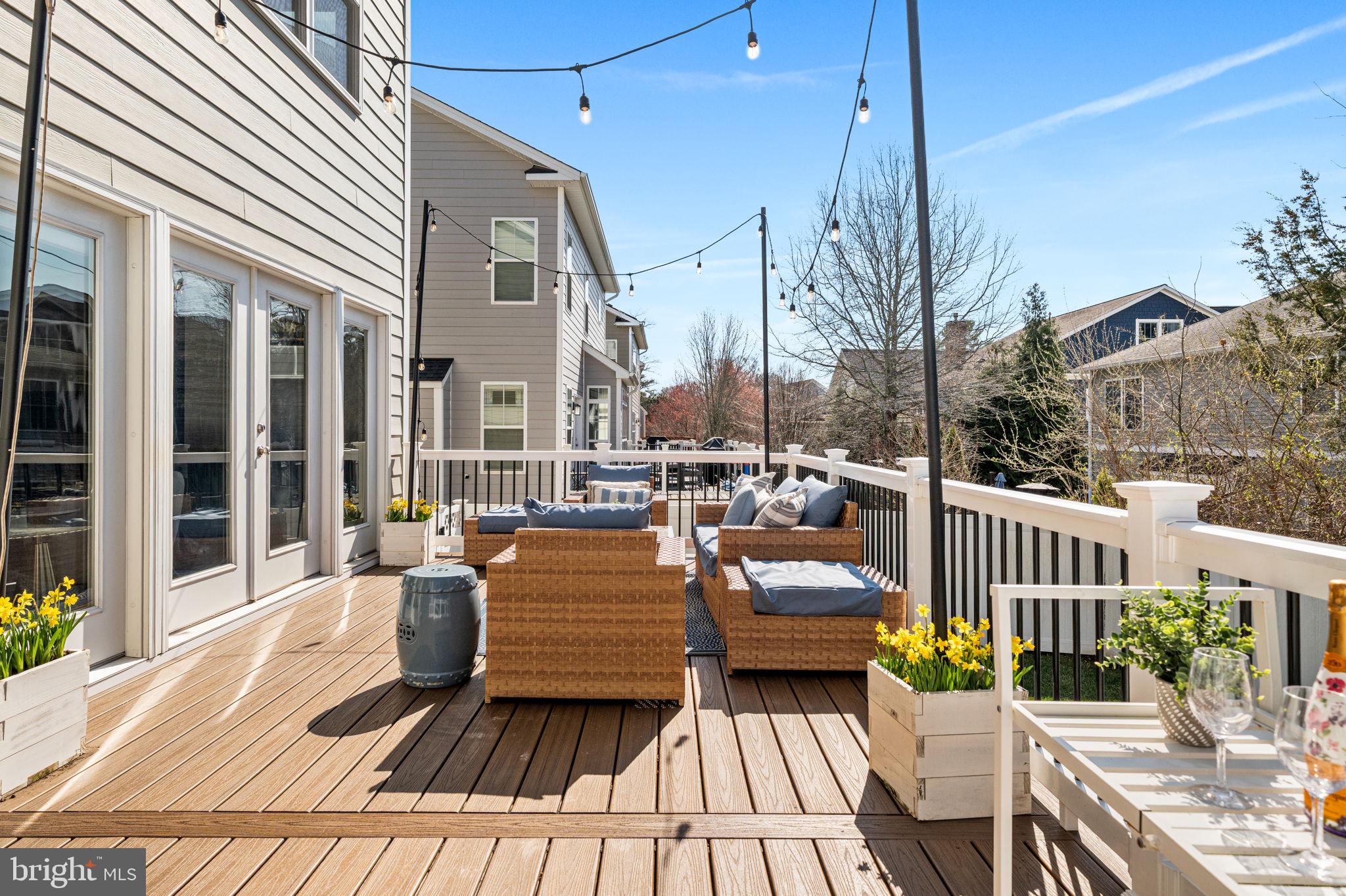 8032 Washington Road Alexandria, VA 22308 - Photo 45 of 50 a view of a patio with couches chairs and wooden floor