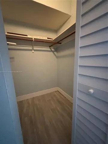 a view of an empty walk in closet