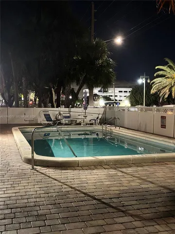 a view of a swimming pool with a patio