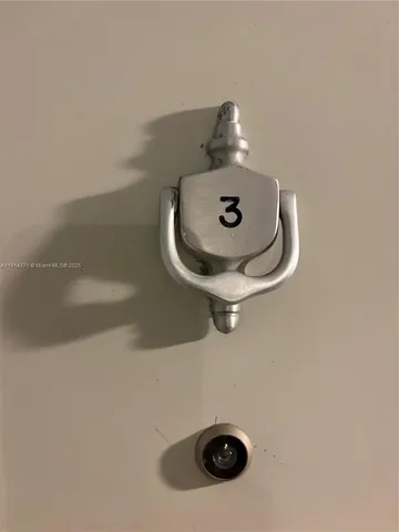 a bathroom with a light fixture and a stove