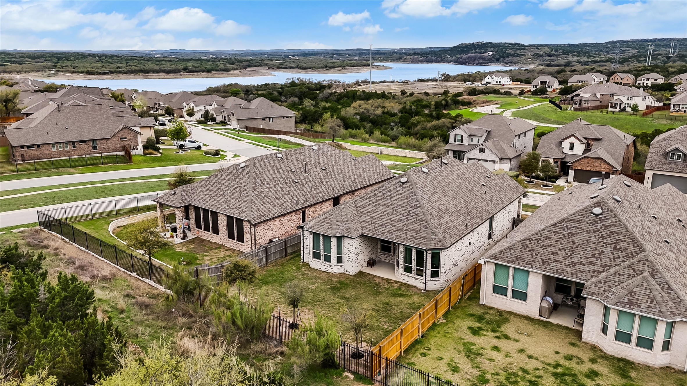 7705 Pace Ravine Drive Lago Vista, TX 78645 - Photo 31 of 40 Aerial perspective of suburban area with a nearby body of water