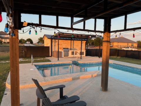 474 Peck Street Kyle, TX 78640 - Photo 4 of 15 a view of a patio with a table and chairs