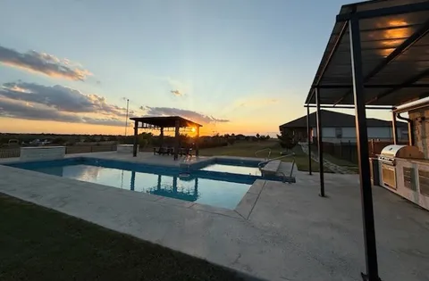 a view of a terrace with sitting area