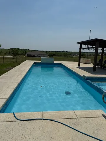 a view of a swimming pool with a lake view