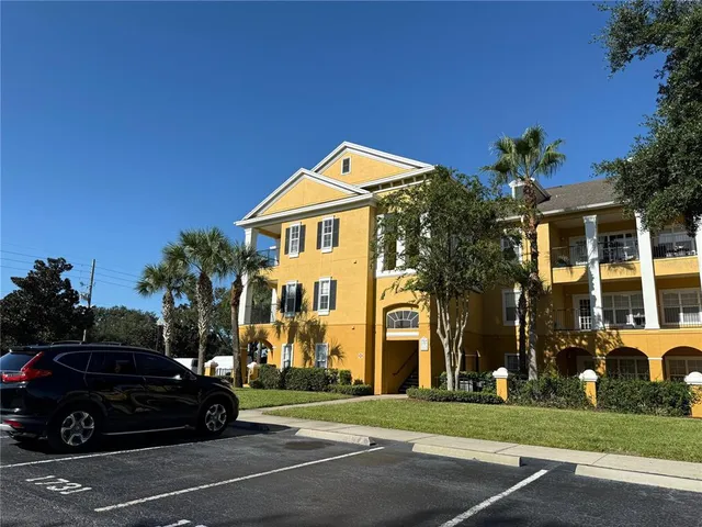 a view of a parked cars in front of a building