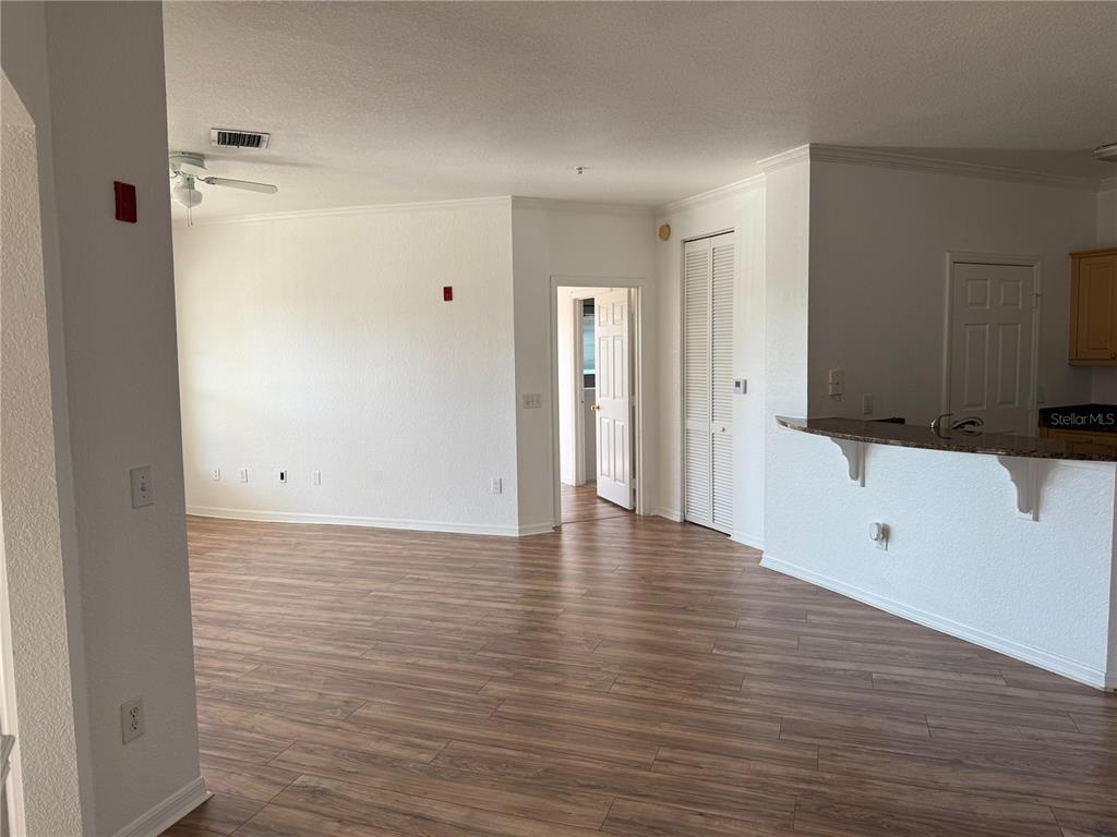3707 Conroy Road, Unit 1731 Orlando, FL 32839 - Photo 12 of 40 a view of a kitchen with wooden floor