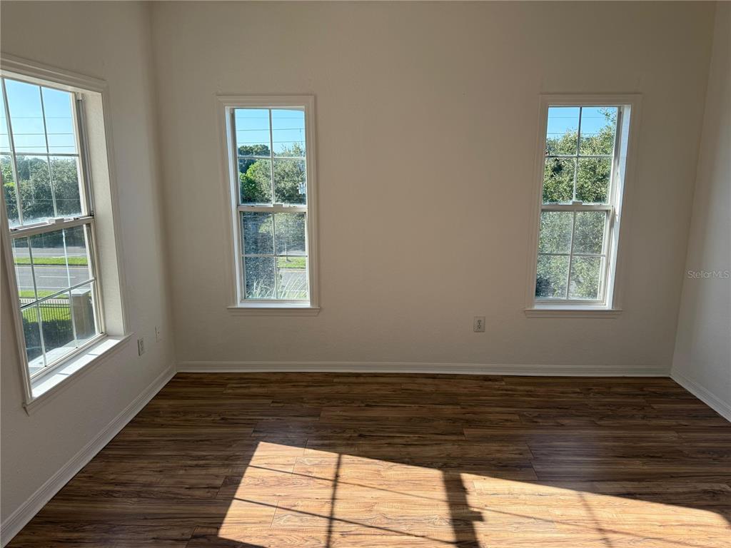 3707 Conroy Road, Unit 1731 Orlando, FL 32839 - Photo 17 of 40 a view of a room with wooden floor and window