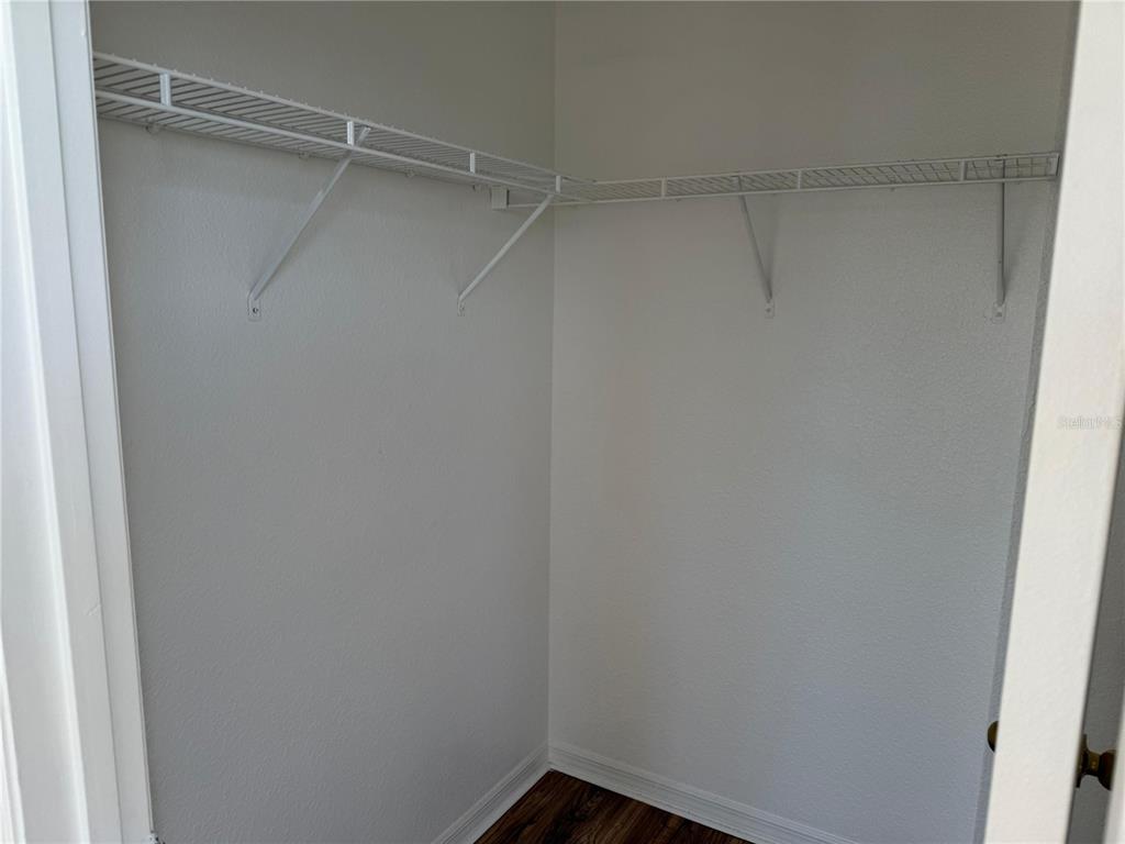 3707 Conroy Road, Unit 1731 Orlando, FL 32839 - Photo 22 of 40 a view of an empty walk in closet