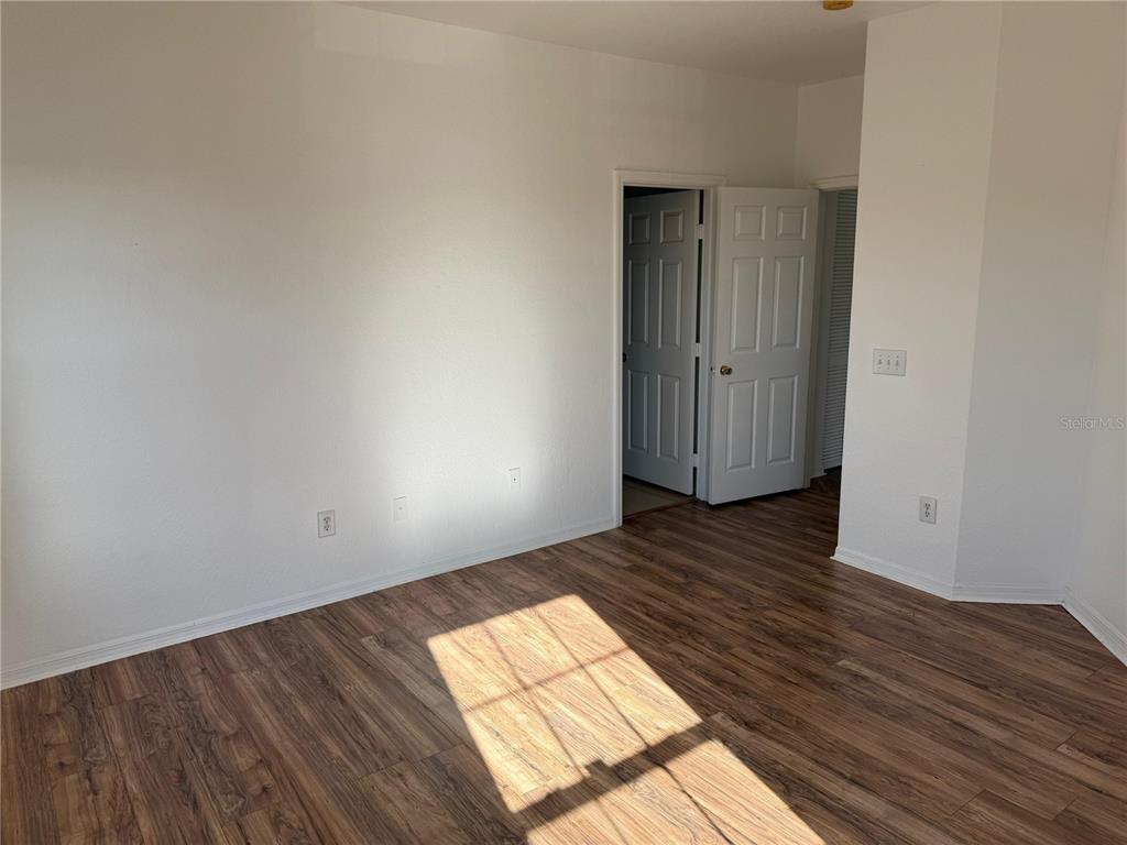 3707 Conroy Road, Unit 1731 Orlando, FL 32839 - Photo 23 of 40 a view of empty room with wooden floor