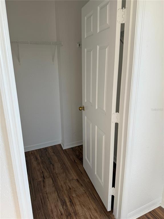 3707 Conroy Road, Unit 1731 Orlando, FL 32839 - Photo 26 of 40 a view of a hallway with wooden floor and staircase