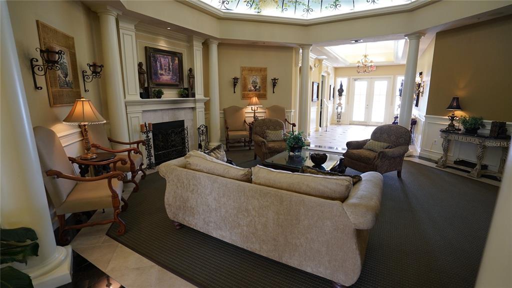 3707 Conroy Road, Unit 1731 Orlando, FL 32839 - Photo 40 of 40 a living room with furniture a fireplace and a flat screen tv