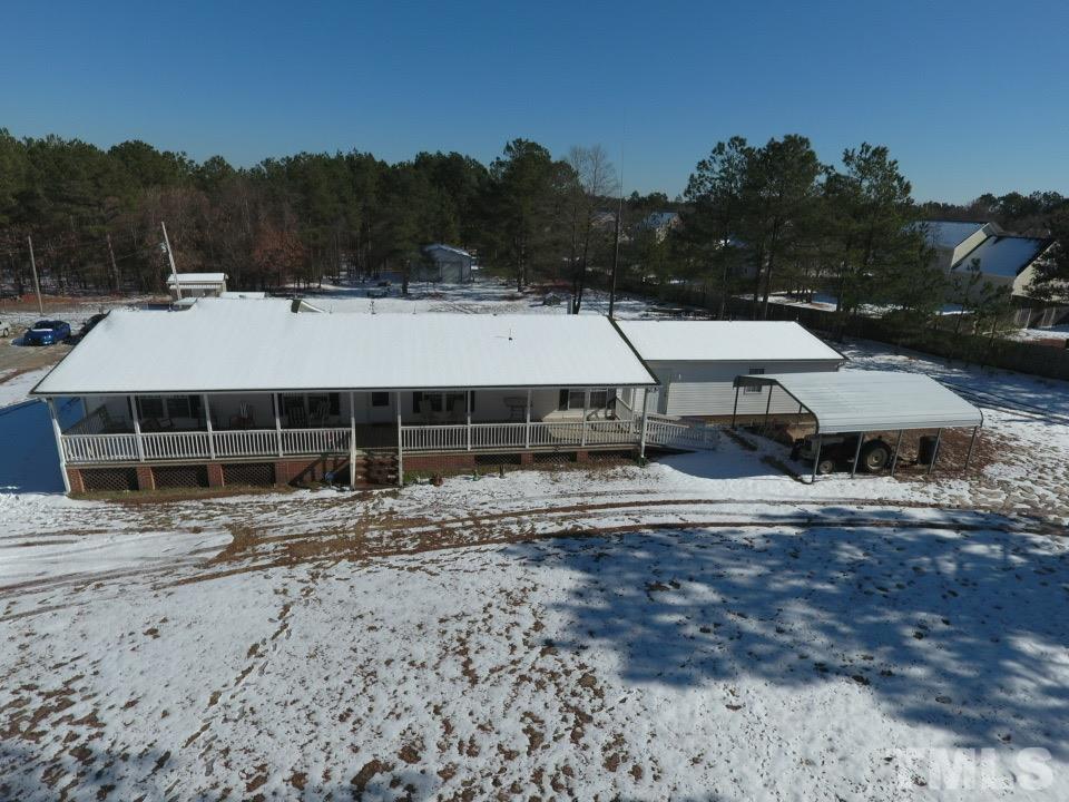 1229 Tingen Road Broadway, NC 27505 - Photo 1 of 17 a view of a house with a yard