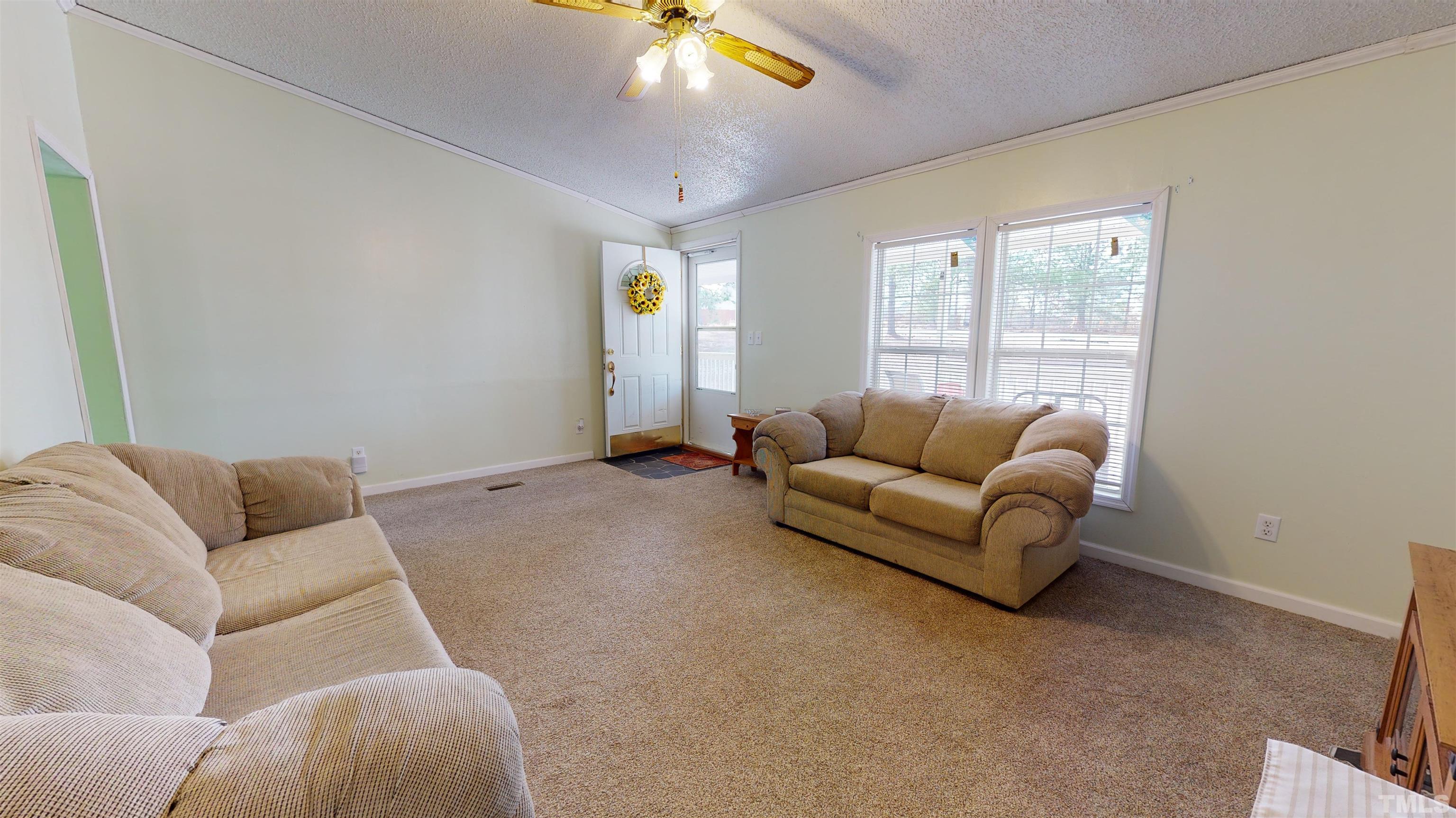 1229 Tingen Road Broadway, NC 27505 - Photo 5 of 17 a living room with furniture and a window