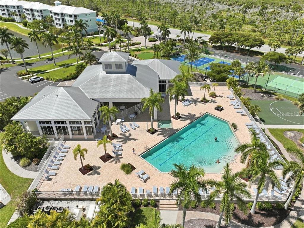 8411 Placida Road, Unit 407 Placida, FL 33946 - Photo 40 of 43 an aerial view of a house with yard swimming pool and outdoor seating