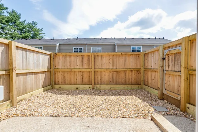a view of backyard with tub