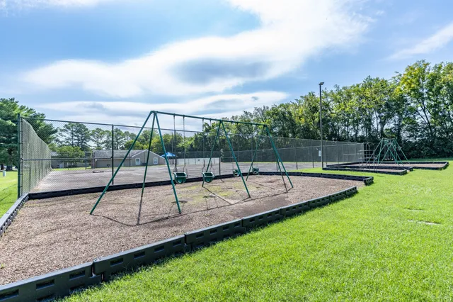 a view of a park with a slide