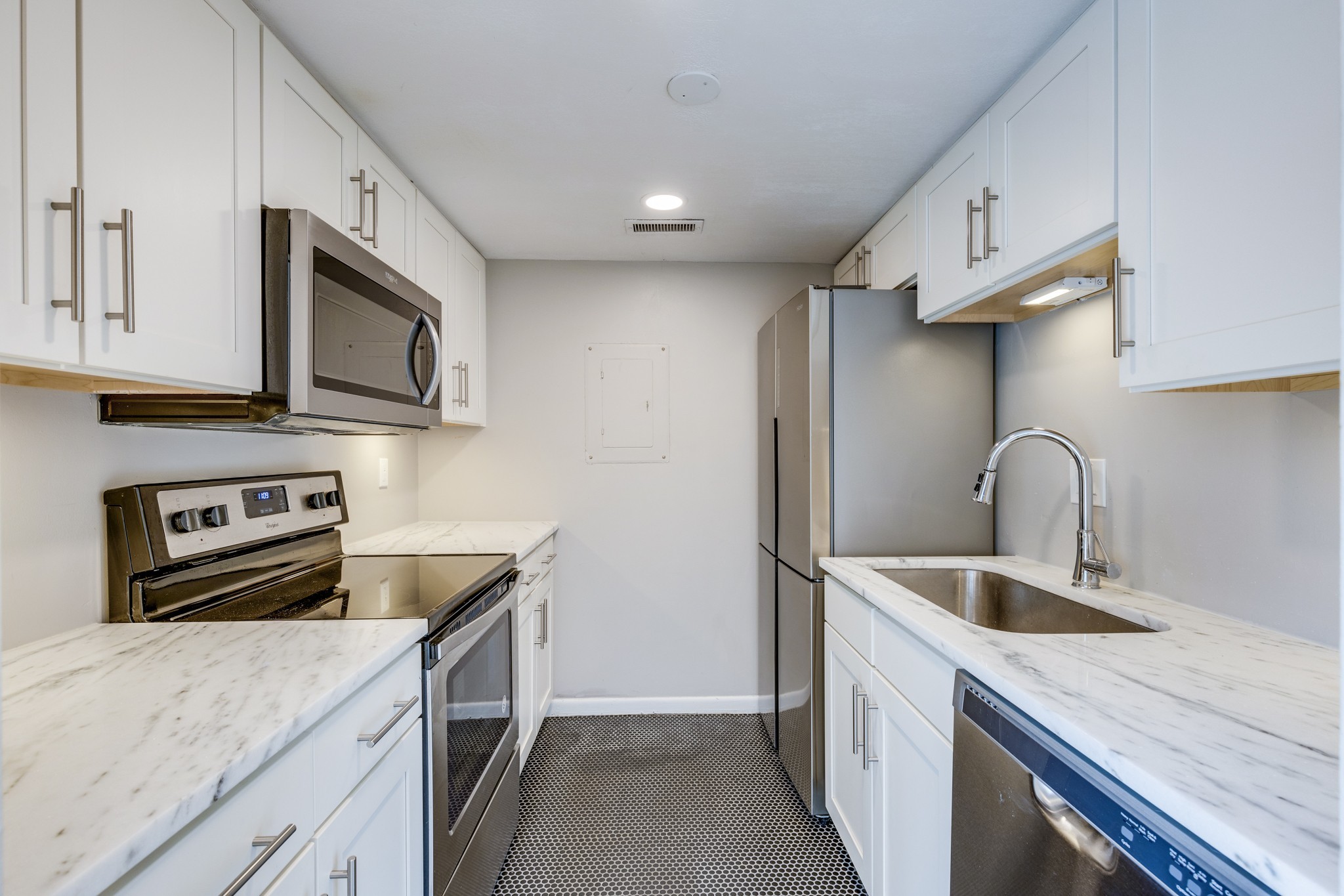 2004 Granville Road Franklin, TN 37064 - Photo 6 of 37 a kitchen with stainless steel appliances granite countertop a sink stove and refrigerator