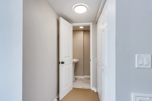 a view of a hallway with a room